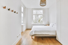 Light Bedroom With Wooden Wardrobe