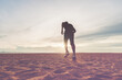 © sutadimages - The man with runner on the desert at sunset. Running for exercise.