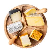 Cheese plate isolated on white background. Pieces of different cheese on wooden tray. Cheese platter. Top view.