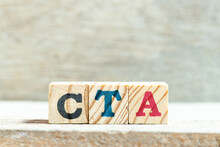 Alphabet Letter Block In Word CTA (Abbreviation Of Call To Action Or Chartered Tax Adviser) On Wood Background
