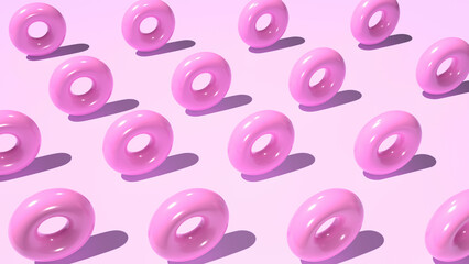 Abstract pink background of plastic donuts