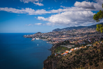 Wall Mural - Panoramic view over Funchal, from Miradouro das Neves viewpoint, Madeira island, Portugal. October 2021