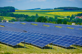 Fototapeta Góry - Photovoltaic cells producing renewable energy in rural landscape