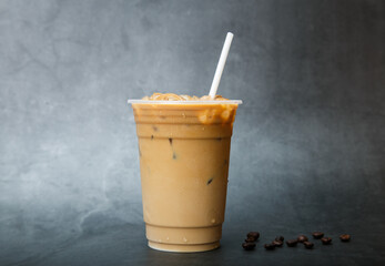 iced espresso coffee on plastic cup place black marble background. copy space your text