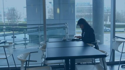 Poster - Animation of earth day text over biracial businesswoman working in office