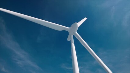 3d wind farm with blue sky in the background. alternative renewable energy generation. environmental