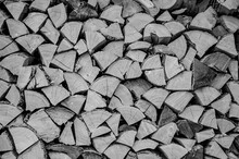 Stacked Dry Split Wood For Heating In A Northern Cold Climate.