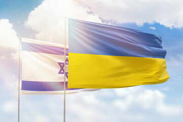 Wall Mural - Sunny blue sky and flags of ukraine and israel