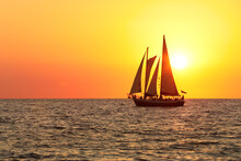 Sail Boat Silhouette In The Sun Set At The Beach