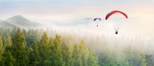 Paragliding In The Sky. Paraglider  Flying Over Landscape Sun Set Concept Of Extreme Sport, Taking Adventure Challenge.