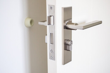 Wall mounted door stopper with modern door handle