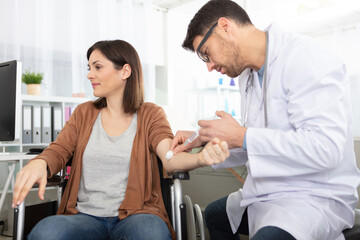 doctor making vaccination injection to patient