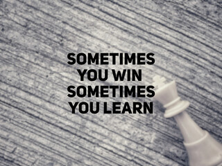 Inspirational and Motivational Concept - 'sometimes you win sometimes you learn' text background.