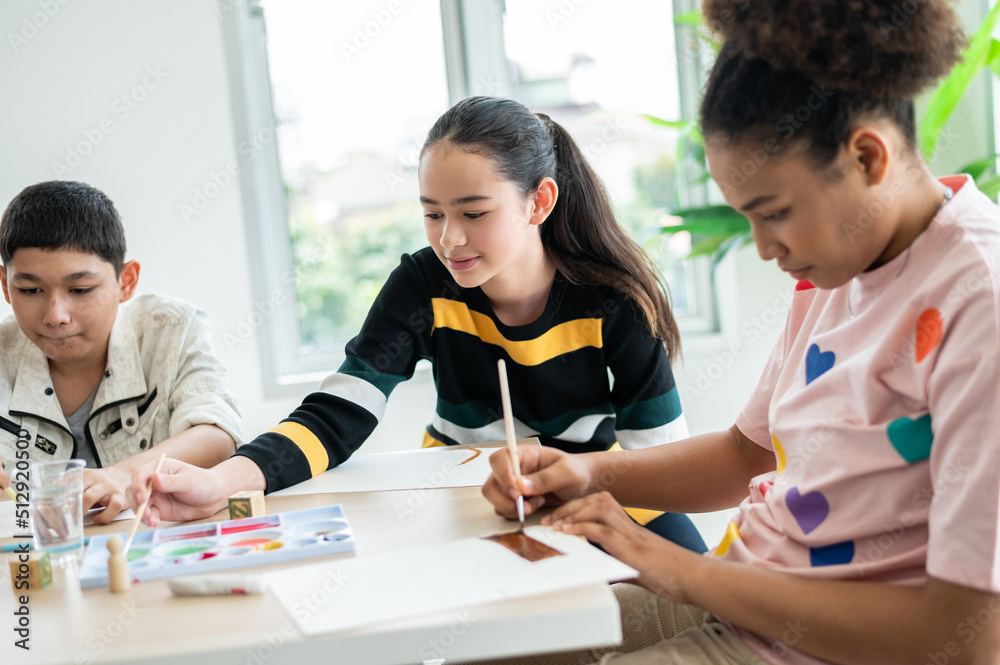 Children are painting and painting in the art classroom. Concept Home ...