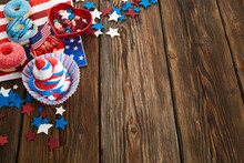 American Independence Day, Celebration And Holidays Concept - Glazed Donut, Candies, Cupcakes In Disposable Tableware And Stars.