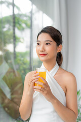 Wall Mural - Beautiful beauty woman Asian cute girl feel happy drinking orange juice for good health in the morning