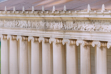 A smooth and rhythmic row of classical Greek columns in the ancient temple of the Olympian Gods