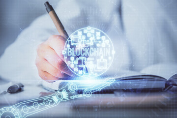 Poster - Cryptocurrency hologram over woman's hands writing background. Concept of blockchain. Double exposure