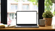 canvas print picture - Front view laptop computer, coffee cup, houseplant and notebook on white table. Comfortable workplace