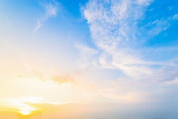 Wall Mural - Sky blue and orange light of the sun through the clouds in the sky