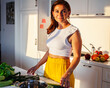 real cheerful lady on kitchen preparing dinner, lifestyle people concept