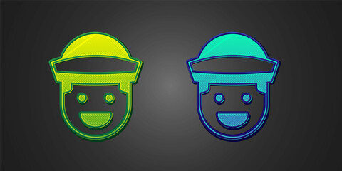 Sticker - Green and blue Sailor icon isolated on black background. Vector