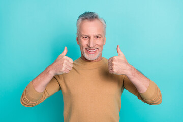 Sticker - Photo of positive friendly person two hands fingers show thumb up isolated on teal color background