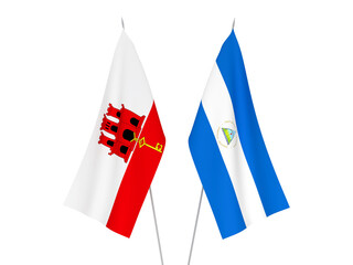 National fabric flags of Gibraltar and Nicaragua isolated on white background. 3d rendering illustration.