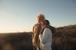 © Tetra Images - Older Caucasian couple hugging outdoors