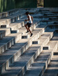© Tetra Images - Man jogging up steps