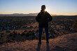 © Tetra Images - USA, New Mexico, Lamy, Rear view of man in desert landscape at sunset in Galisteo Basin Preserve