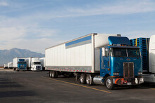 USA, California, Semi Trucks In Parking Lot