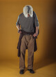 © qunica.com - Portrait of a smart young man standing against yellow backgroun