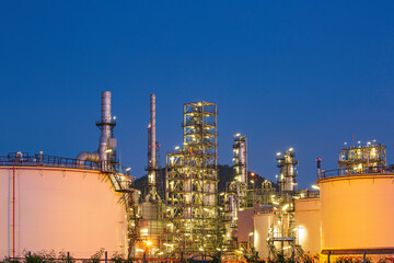 Twilight scene of tank oil refinery plant and tower column of Petrochemistry industry