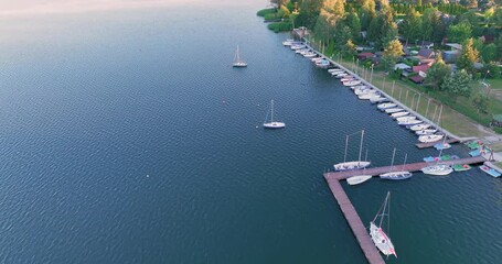 Poster - Aerial view of Boats moored to the shore, marina. Drone View of yachts on the lake. The concept of sailing yachts, boats on the lake, sea.