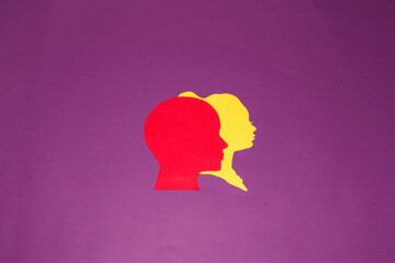 male red next to female yellow paper head, couple on purple background, two people going through life together, love, respect