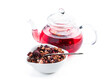 Hot fruit tea in glass teapot isolated on white