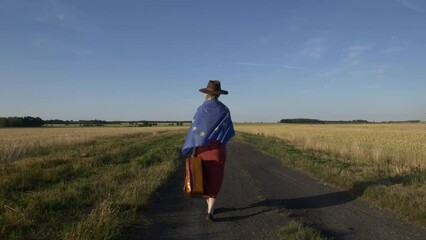 Sticker - Girl in EU flag with suitcase on country road in sunset