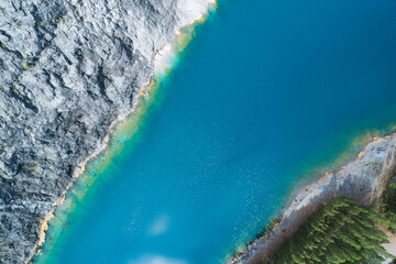 Wall Mural - Aerial view of amazing pond in tropical rainforest forest with mountain rocks peak Beautiful water surface in Phang Nga Thailand