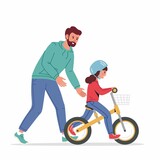Fototapeta Dinusie - Caring dad teaching little daughter in helmet to ride balance bike for first time. Father helping girl kid riding bicycle. Parenting, fatherhood concept. Parent actively spends time with child outdoor
