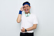 © Bangun Stock Photo - young Asian sportman in blue headband and sportswear white t-shirt with headphones, laughing holding his hand on stomach can't stop laughing after hearing funny anecdotes isolated on white background