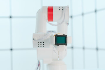 Sticker - Robot arm with CCD and CMOS matrix Image sensor in the manipulator. Concept on the topic of artificial vision and pattern recognition