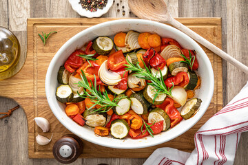 Wall Mural - Baked vegetables mix. Oven roasted carrots, onion, zucchini and bell pepper.