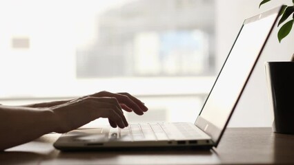 Close Up Female Hands Using Keyboard Laptop. Woman Working With Laptop on Desktop Next to Window. Businesswoman Scrolling News Feed Online shopping at Work. Woman Office Worker Typing on Keyboard.