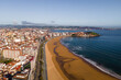 Aerial view of Gijon town along the coast with Playa de San Lorenzo, Asturias, Spain.