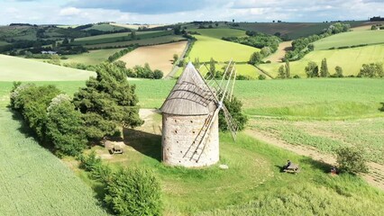 Wall Mural - moulin à vent et champ de blé surplombant la campagne française	
