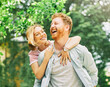 © Lumos sp - woman couple man happy happiness  love young lifestyle together romantic boyfriend girlfriend laughing hug piggyback