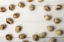 Quail Eggs On A White Texture Background. Natural Products. Place For Text. Fresh Quail Eggs.