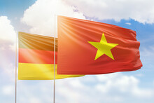 Sunny Blue Sky And Flags Of Vietnam And Germany