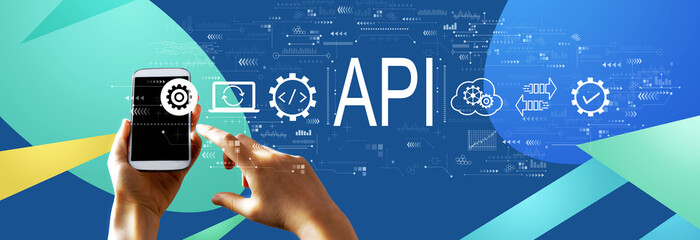 api - application programming interface concept with person using a smartphone